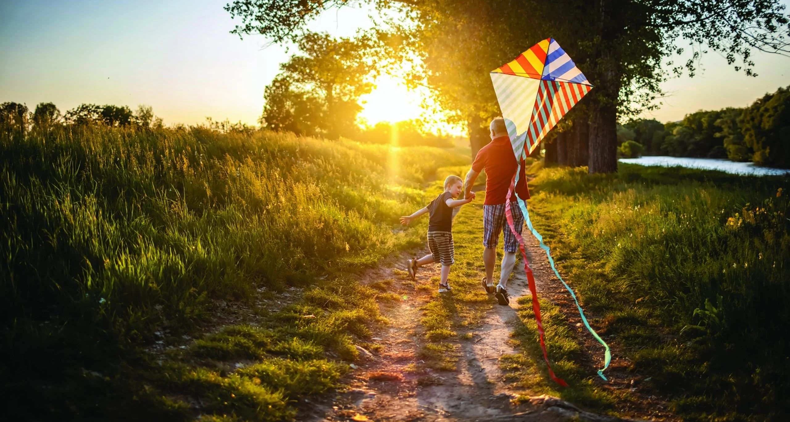 Grandfather and boy with kite