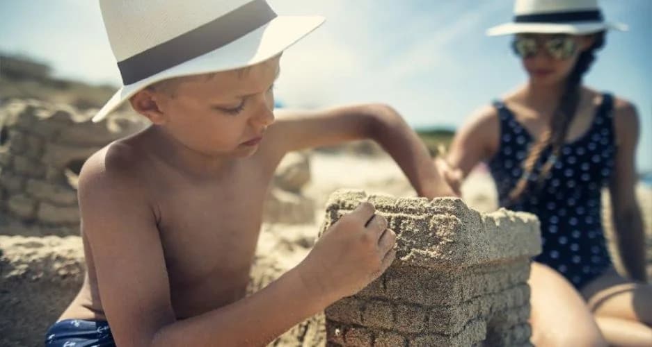 Children building sandcastles